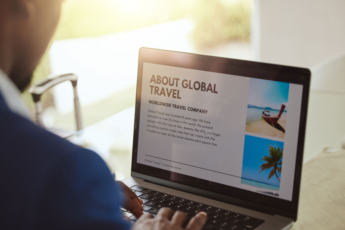 looking at travel site on laptop
