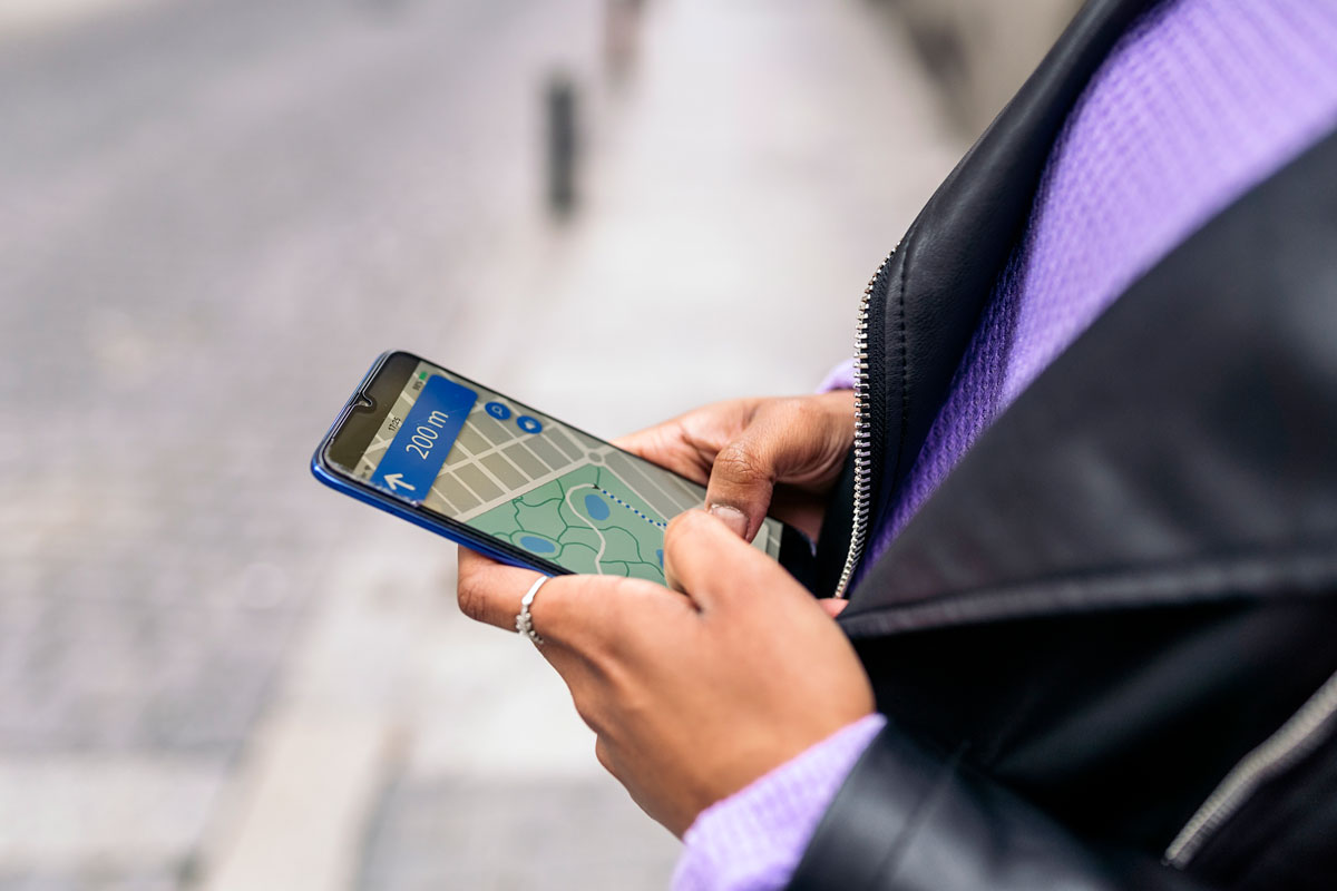 looking at mobile phone for directions when traveling