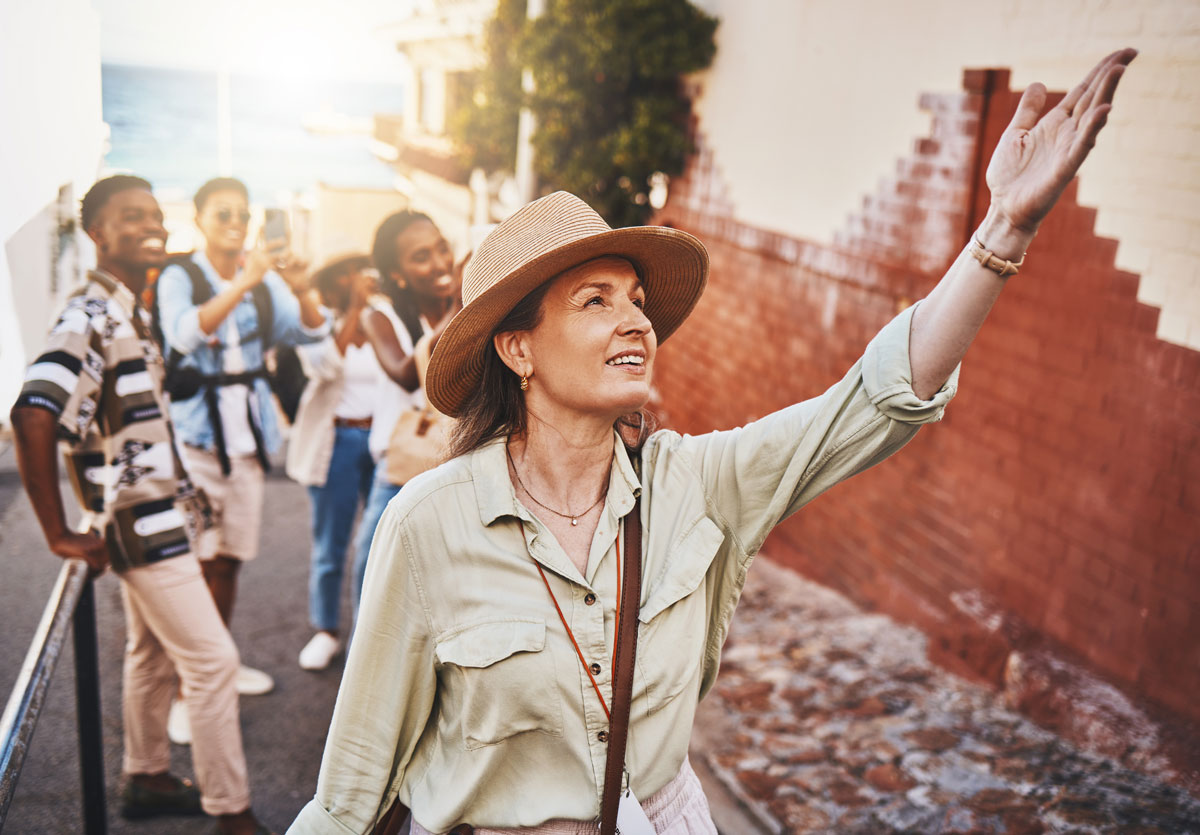 group of travelers being led by tour guide