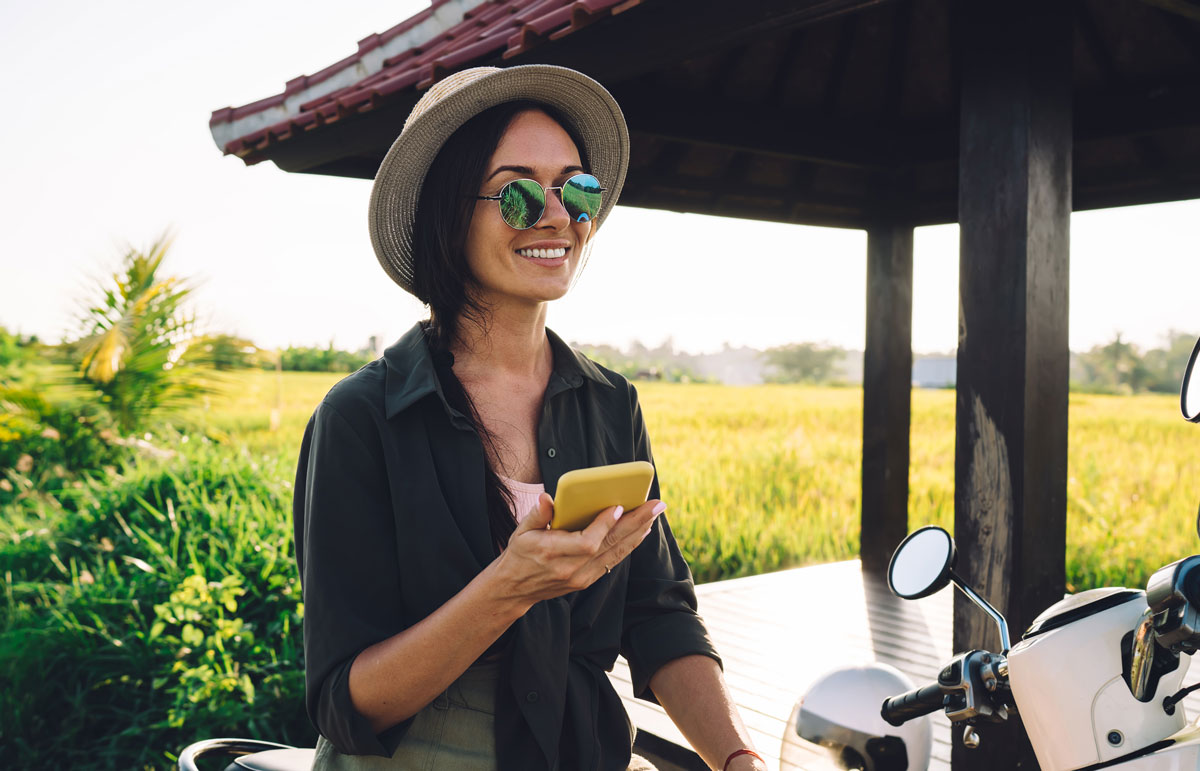 Women using phone on a destination vacation