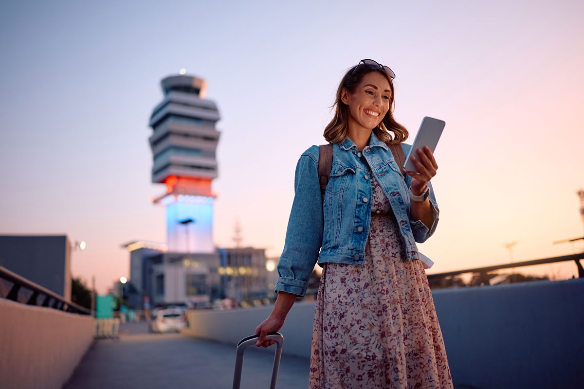 women using mobile phone while traveling