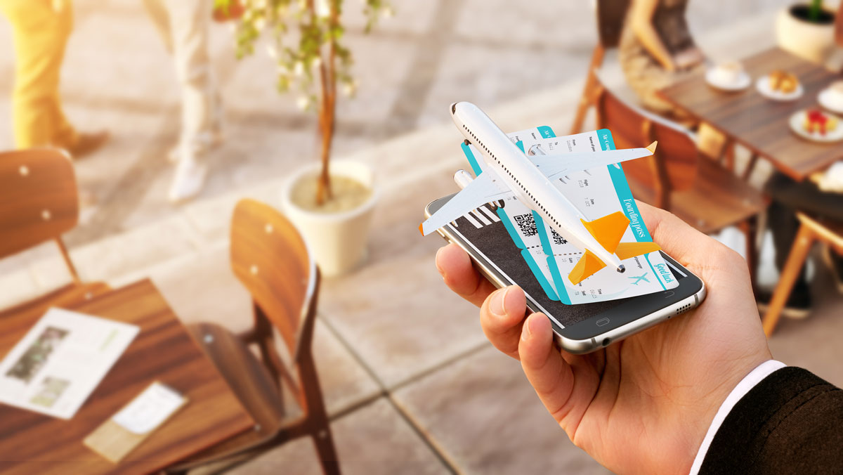 A traveler using a smartphone planning a trip