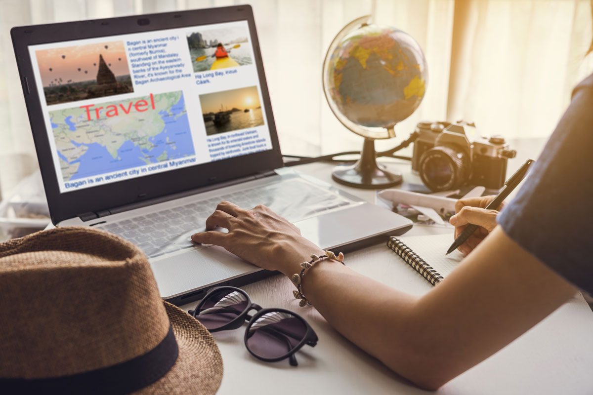 a traveler with multiple browser tabs open on a laptop